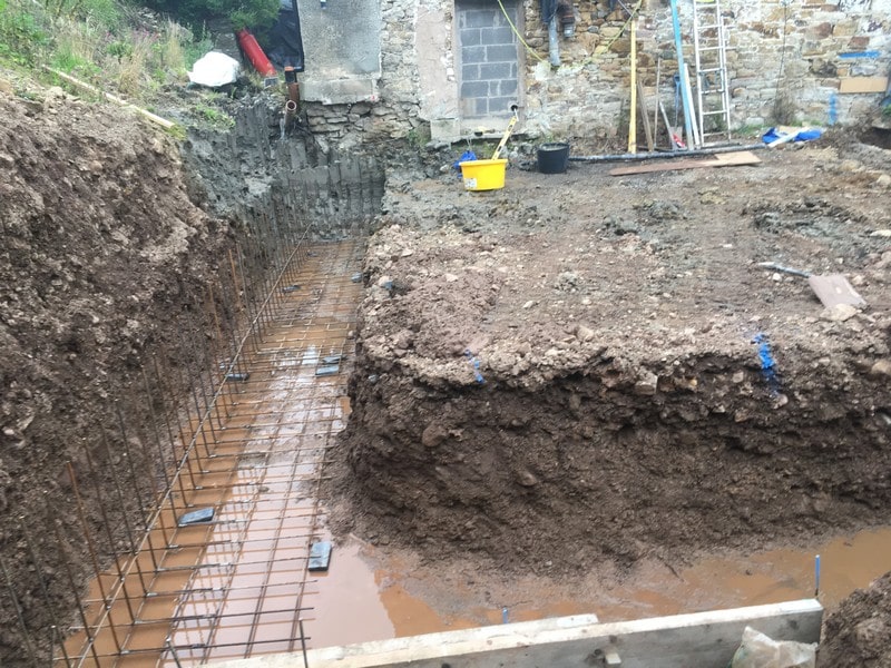 Foundations for extension and retaining wall